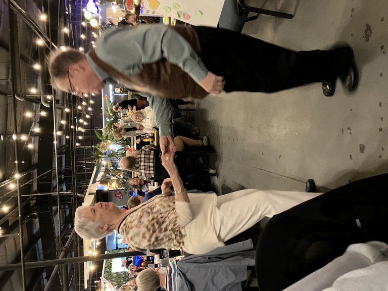 People dancing at the Food Pantry Benefit